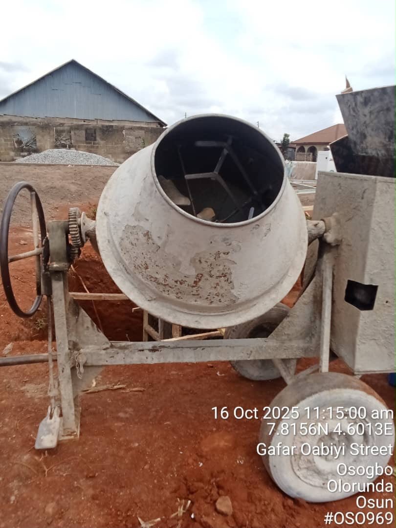 Concrete mixer in use during on-site construction work