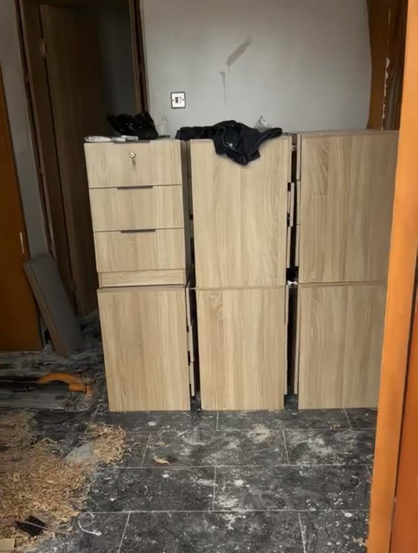 Sourced office storage cabinets awaiting installation